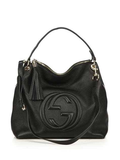 gucci handbag next to a black handbag|gucci black handbag use.